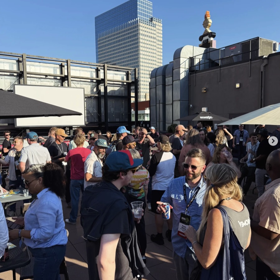 a rooftop event crowd in the sun